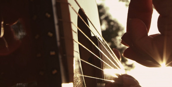 Slow Motion Closeup Of A Hand Playing Guitar
   (Stock Footage) - Download Videohive 2730819